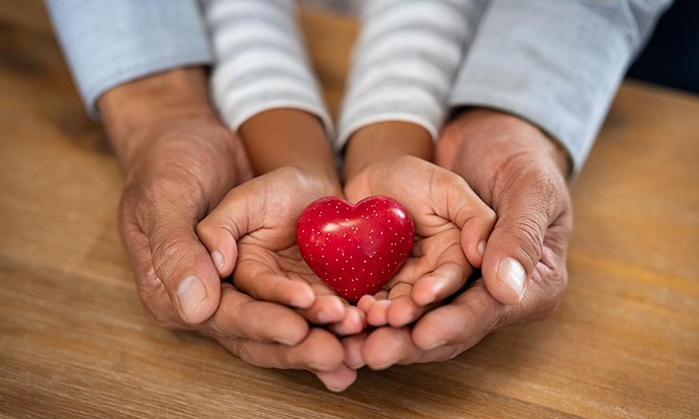 Photo of hands with a heart for Honor Memorial