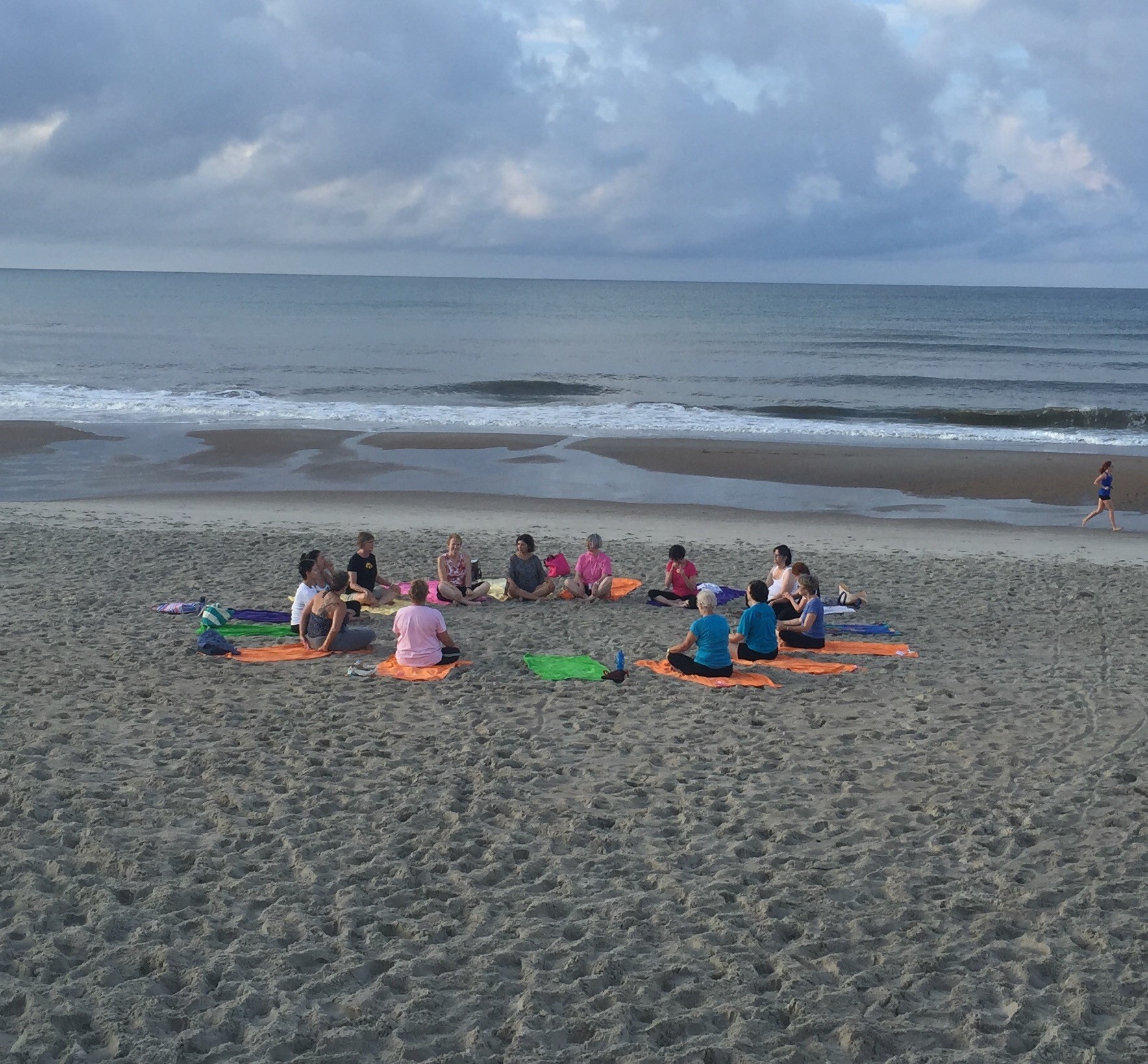 group yoga photo beach